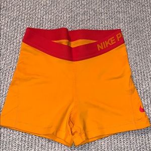 neon orange nike pros 3”